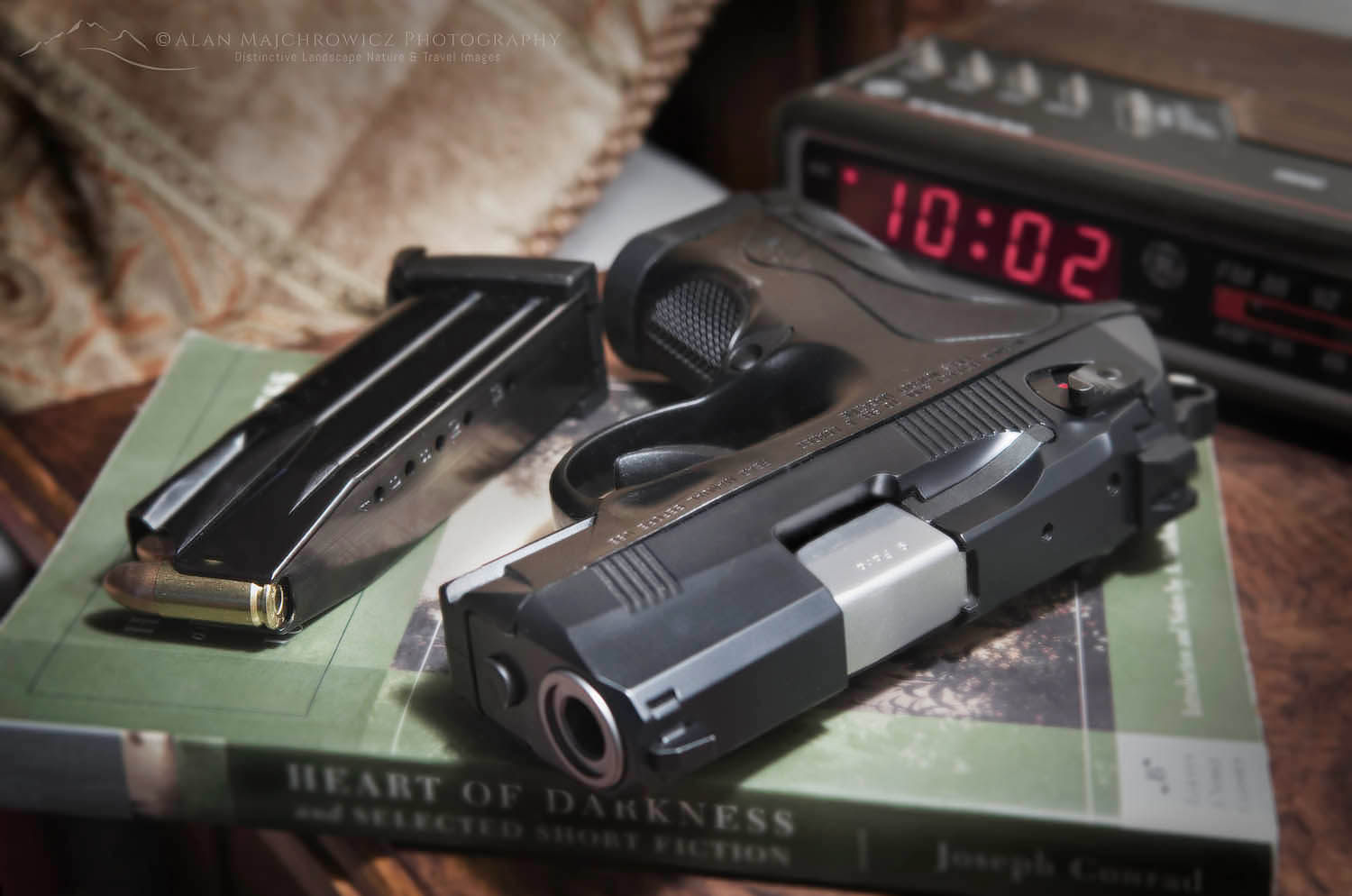 Beretta PX4 Storm semi-automatic pistol with 9mm ammunition on bedroom nightstand